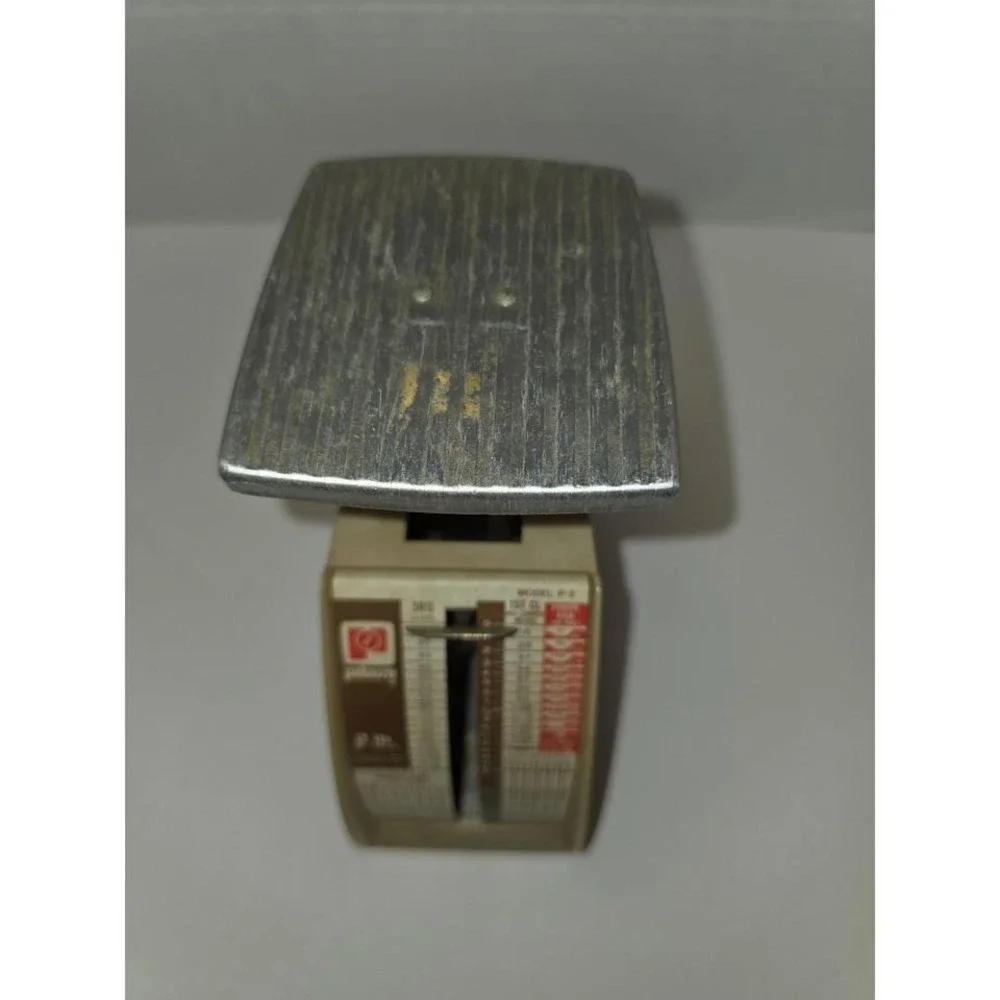 vintage Pelouze Model P-2 postal scale designed to weigh parcels up to 2 pounds.